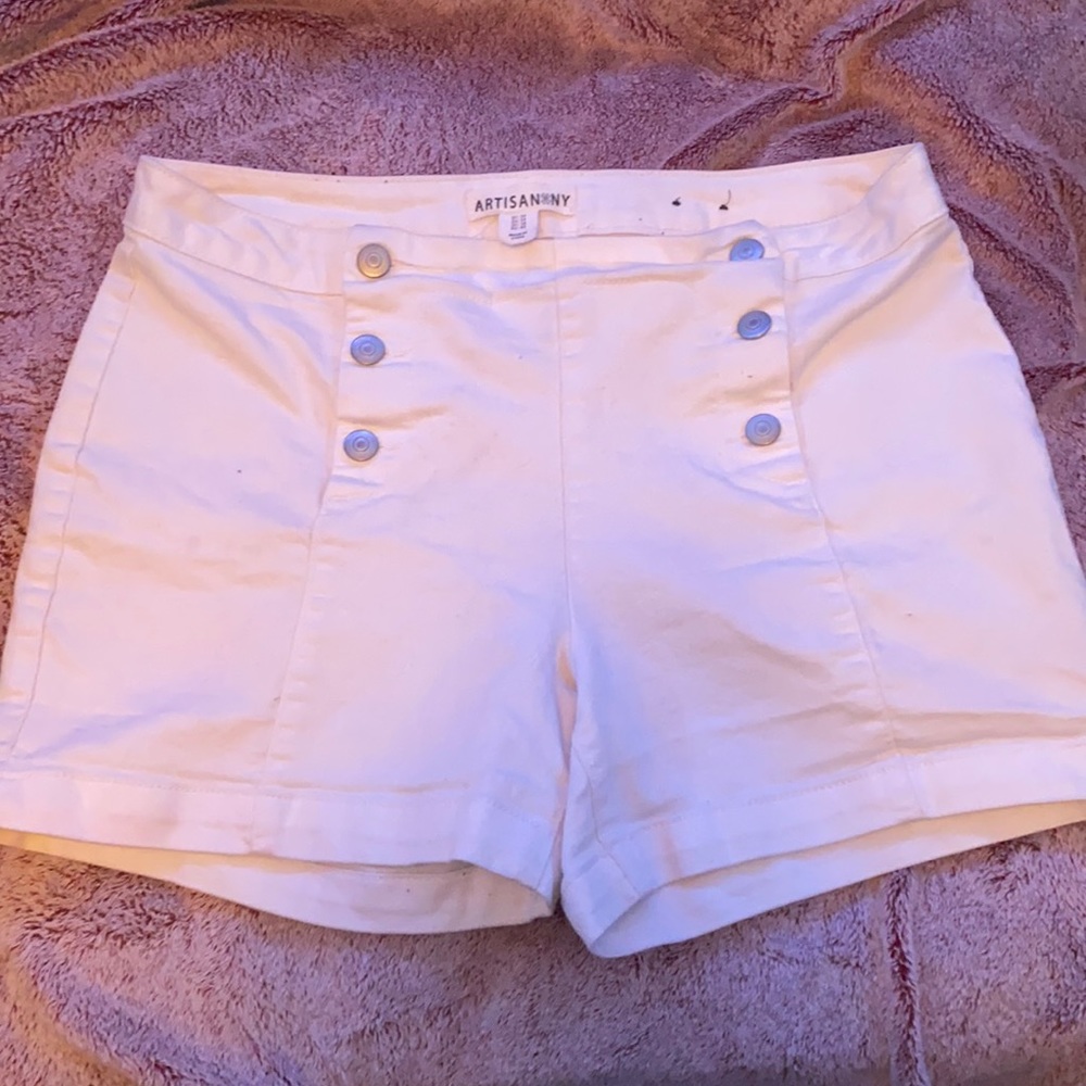 Artisan*NY. These are very cute, comfortable, and stretchy size 14 :)